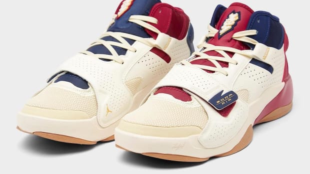 View of red, navy, and tan Jordan Zion shoes.